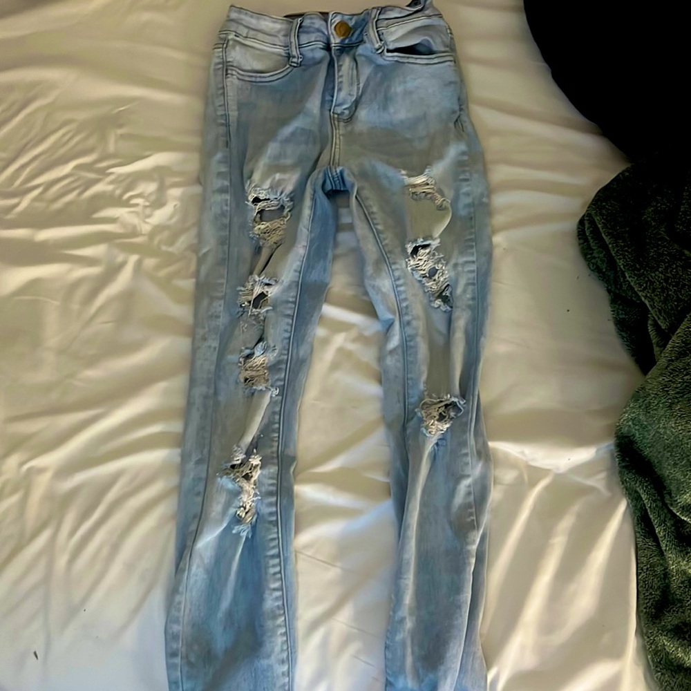 Blue light wash skinny high rise ripped jeans, they were only worn like twice
